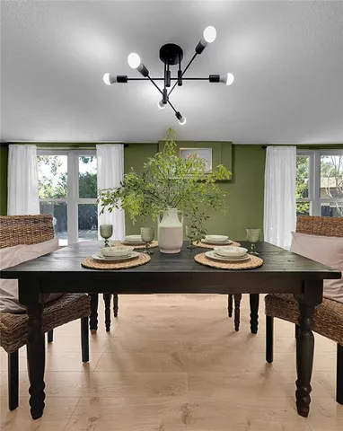 a view of a dining room with furniture window and outside view