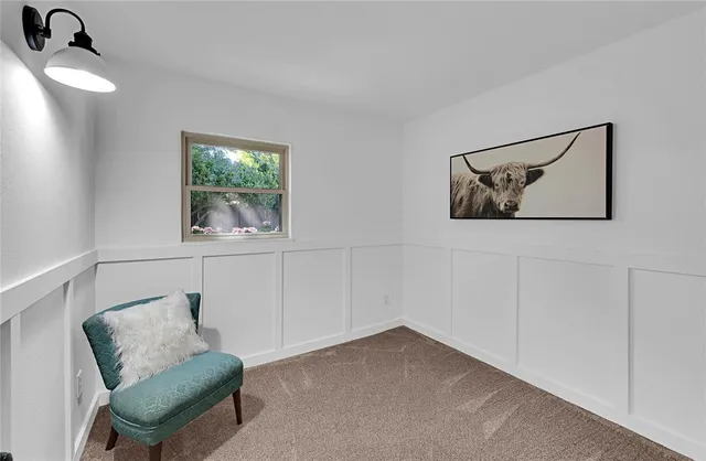 a view of a bedroom with furniture and windows