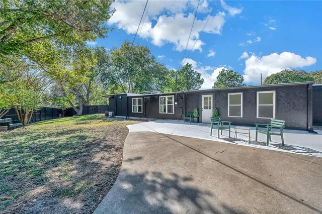a view of swimming pool with outdoor seating
