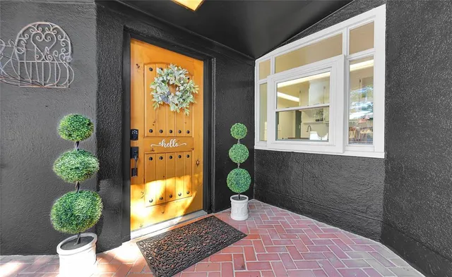 a view of a room with bench wooden floor and window