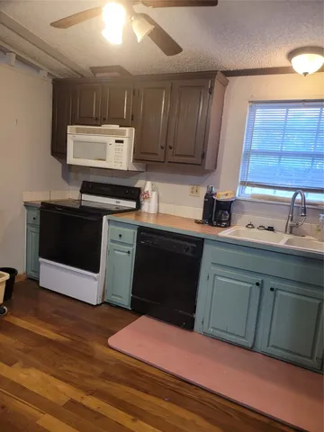 a kitchen with a sink and cabinets