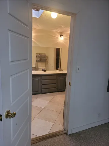 a bathroom with a tub and a sink