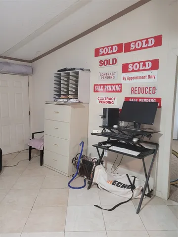 a room with furniture and gym equipment