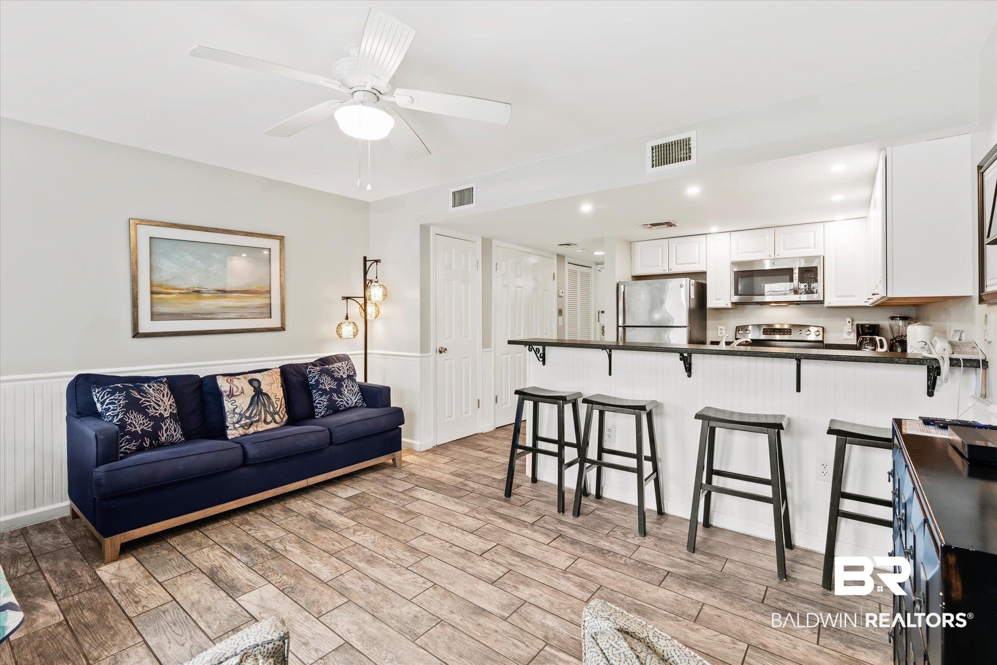 497 Plantation Road, Unit 1164 Gulf Shores, AL 36542 - Photo 5 of 20 Living room featuring ceiling fan and light wood-type flooring