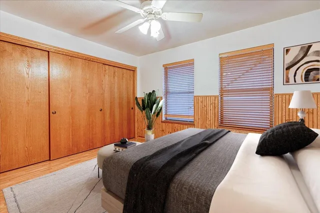 a bedroom with a bed and a closet