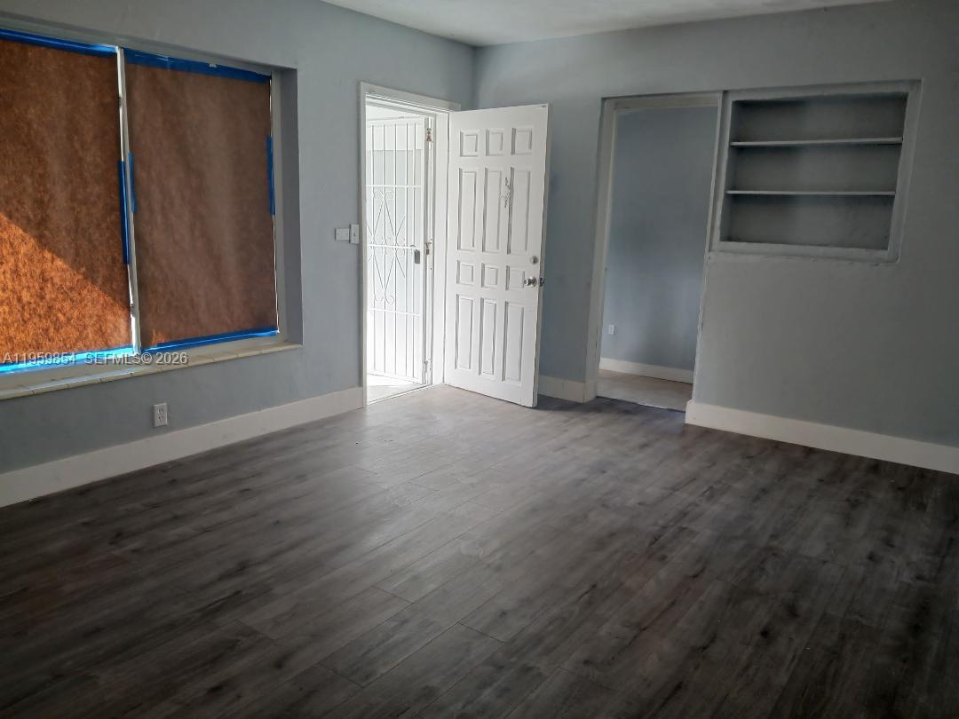 1535 Northwest 85th Street Miami, FL 33147 - Photo 3 of 7 a view of an empty room with a window