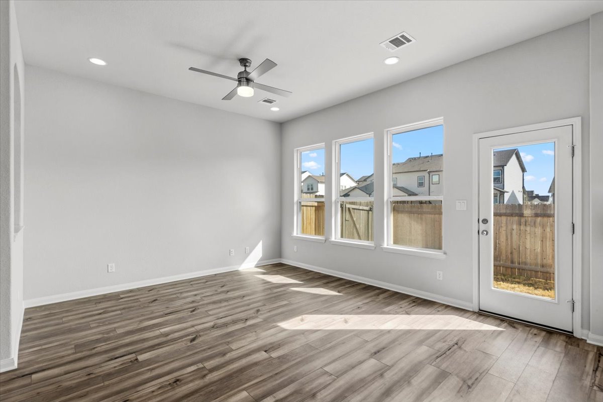 8513 Wellspring Loop Round Rock, TX 78665 - Photo 12 of 40 Unfurnished room featuring a ceiling fan, light wood-type flooring, and recessed lighting