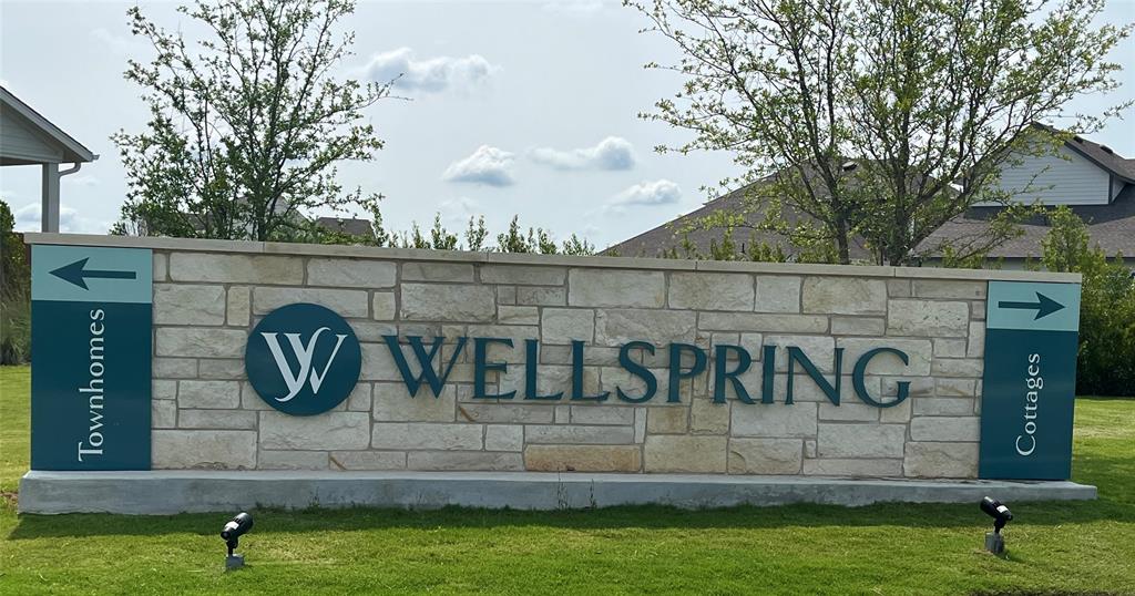 8513 Wellspring Loop Round Rock, TX 78665 - Photo 35 of 40 Community sign featuring a lawn