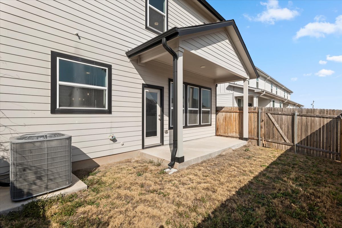 8513 Wellspring Loop Round Rock, TX 78665 - Photo 5 of 40 Rear view of property with a patio area and a gate