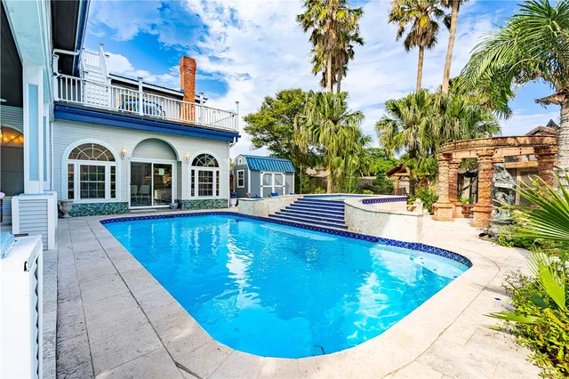 a view of a house with swimming pool