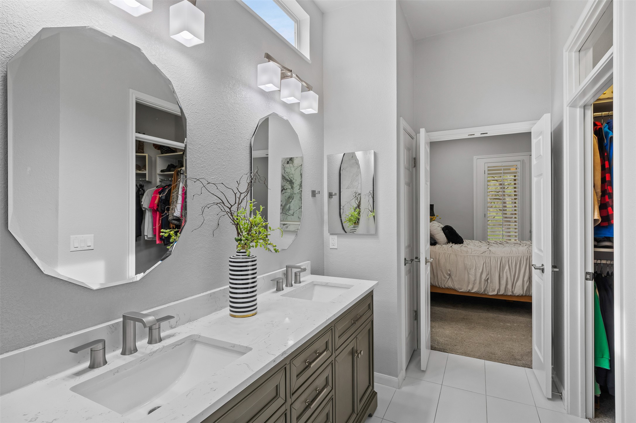144 Stetson Trail Georgetown, TX 78633 - Photo 29 of 39 Ensuite bathroom with a spacious closet, double vanity, and light tile patterned flooring