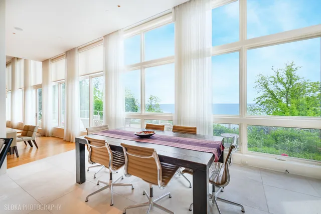 a view of a dining room with furniture window and outside view