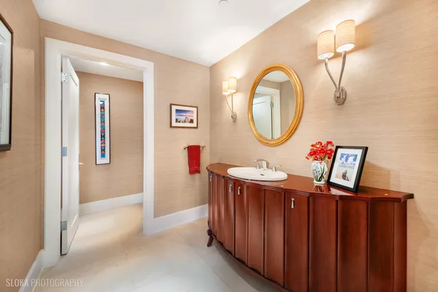 a bathroom with a sink a mirror and shower