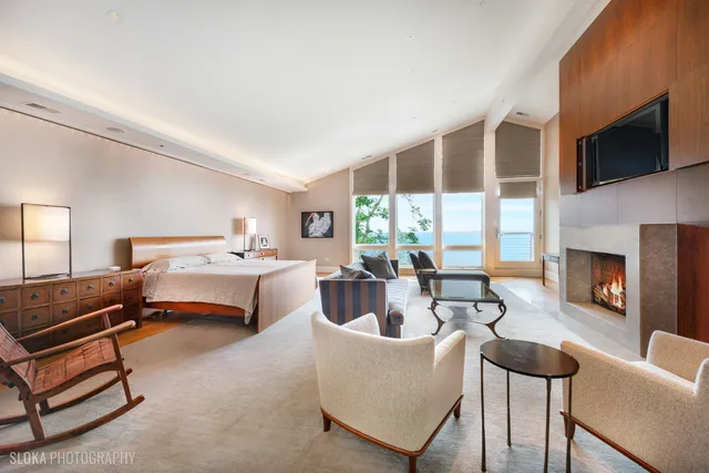 a bathroom with a white bath tub and a shower