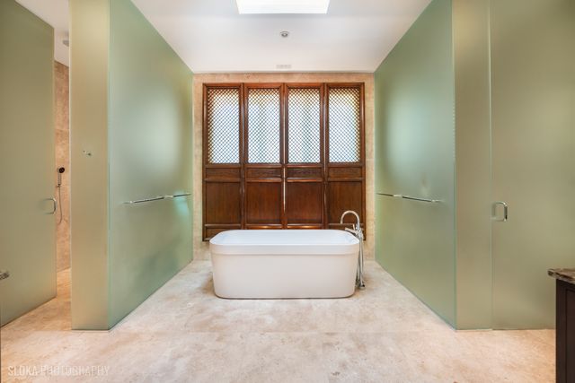 a bathroom with a tub and sink