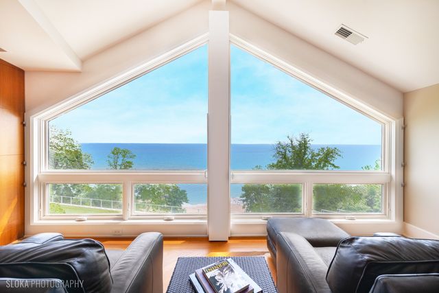 a living room with lots of furniture and a wooden floor