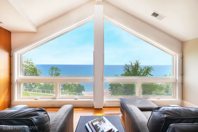 a living room with lots of furniture and a wooden floor