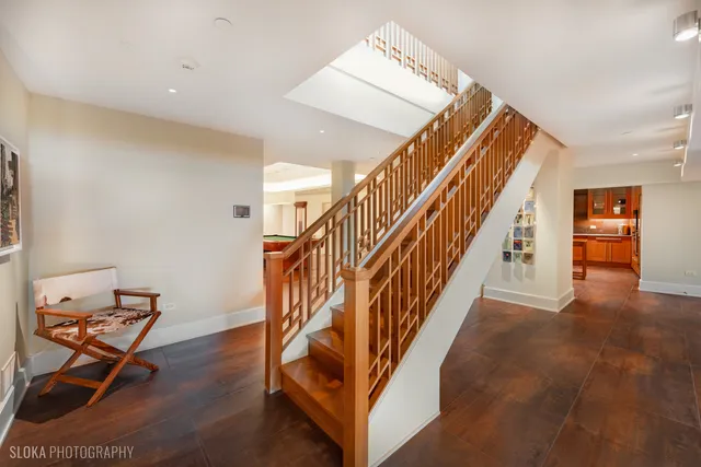 a living room with furniture pool table and a window