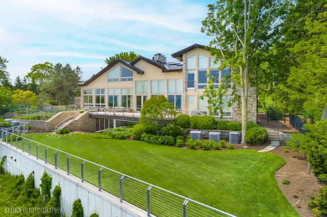 a front view of a house with a yard table and chairs