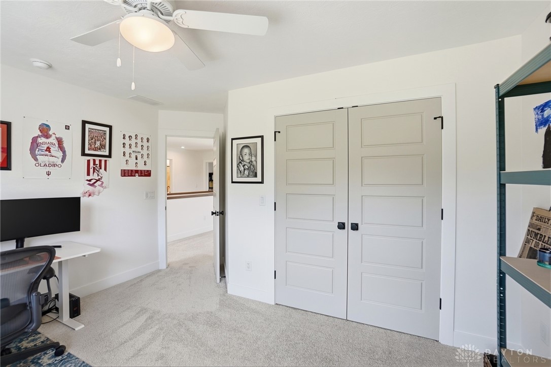 1030 Stevenson Road Wilberforce, OH 45384 - Photo 30 of 57 This bright room features a comfortable carpet and practical closet doors, offering a versatile living space.