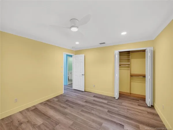 a view of hallway with wooden floor