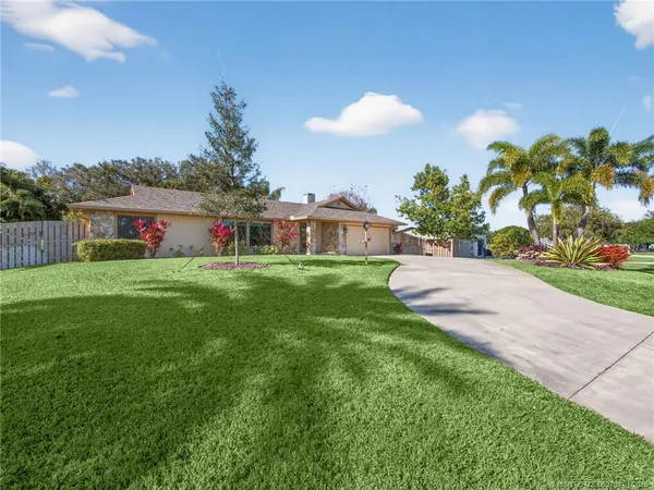 a view of a house with a big yard