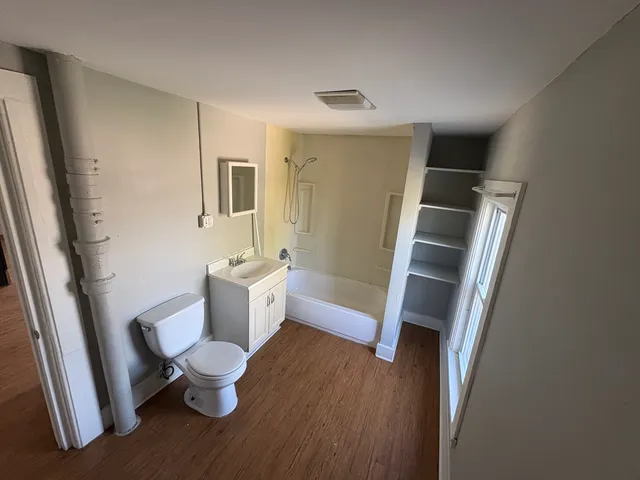 a bathroom with a sink and a large mirror