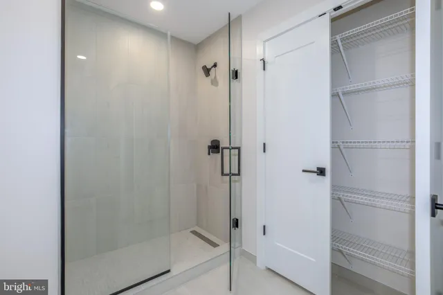 a view of an empty room with glass door