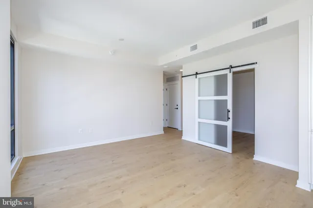 a kitchen with stainless steel appliances granite countertop a stove and a microwave