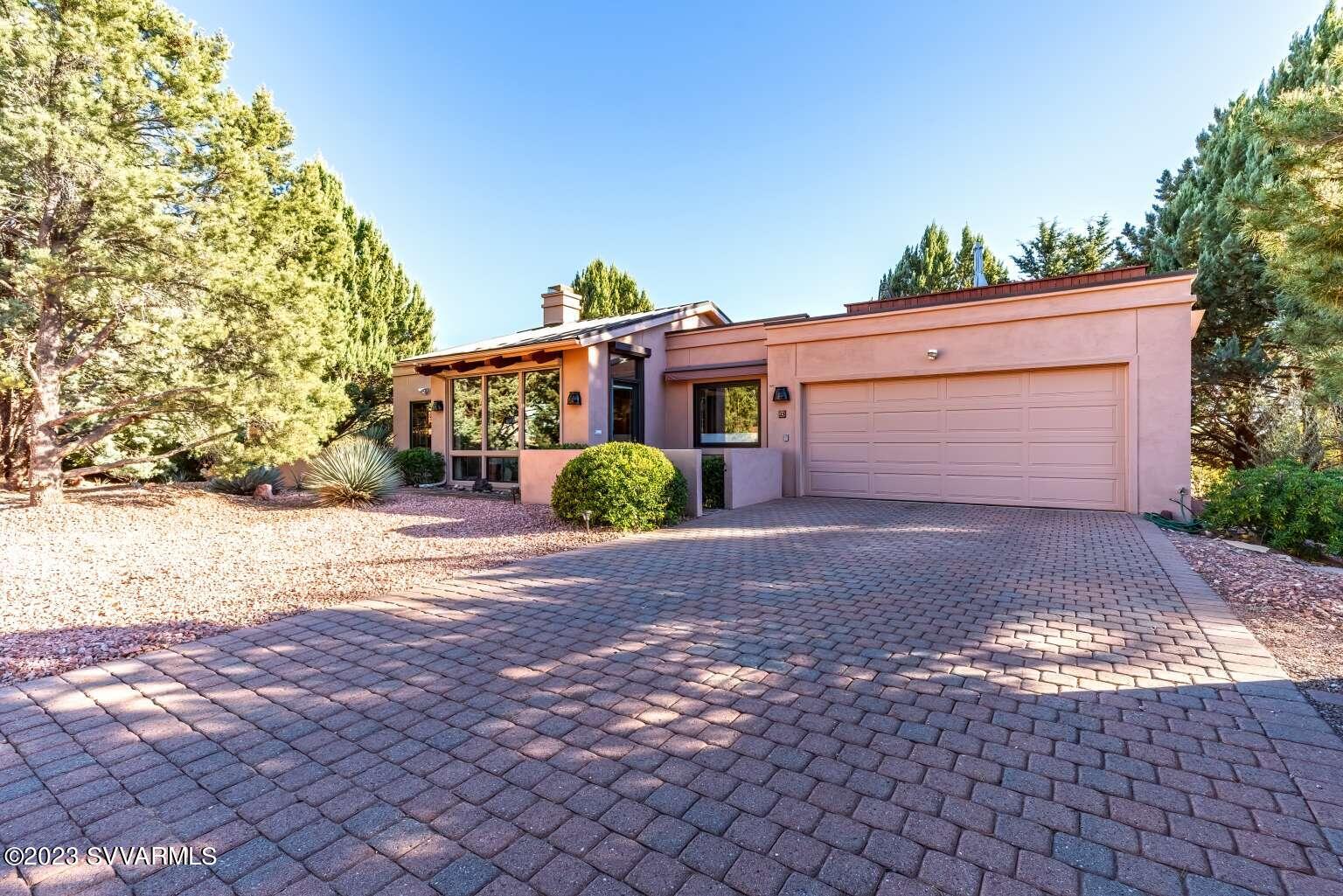 25 Homestead Road Sedona, AZ 86336 - Photo 1 of 25 a front view of house with yard and trees around