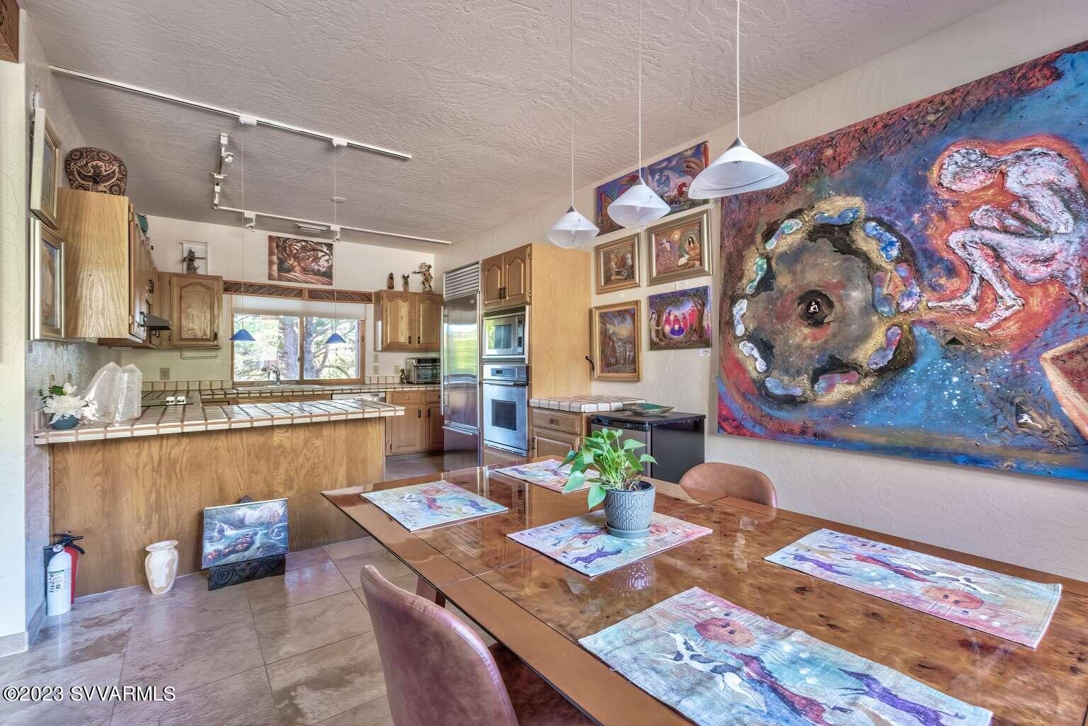 25 Homestead Road Sedona, AZ 86336 - Photo 15 of 25 a dining room with furniture and wooden floor