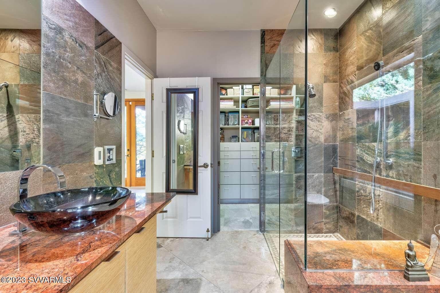 25 Homestead Road Sedona, AZ 86336 - Photo 25 of 25 a bathroom with a granite countertop sink a mirror and next to a window
