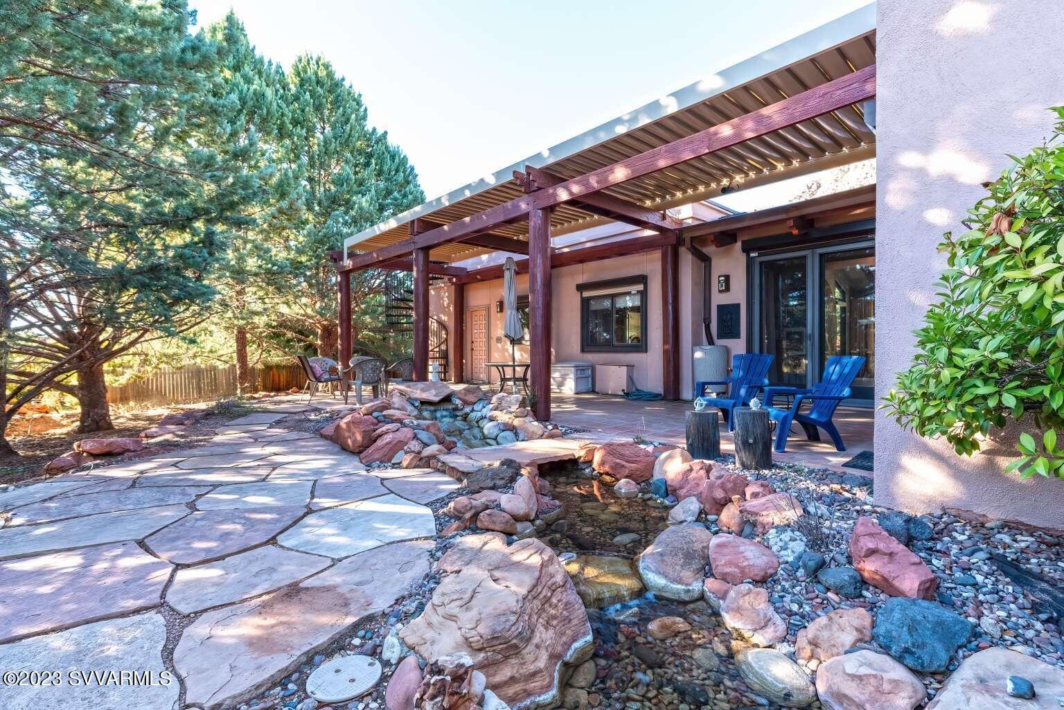 25 Homestead Road Sedona, AZ 86336 - Photo 5 of 25 a view of a patio with chairs and potted plants