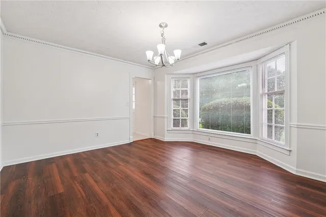 a view of livingroom with window hardwood floor and ceiling fan