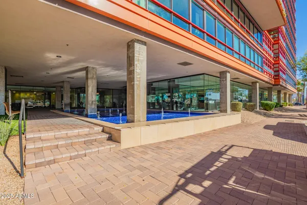 a building exterior with furniture