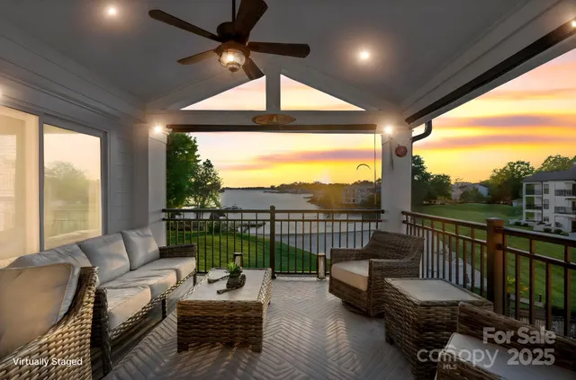a living room with furniture and a floor to ceiling window