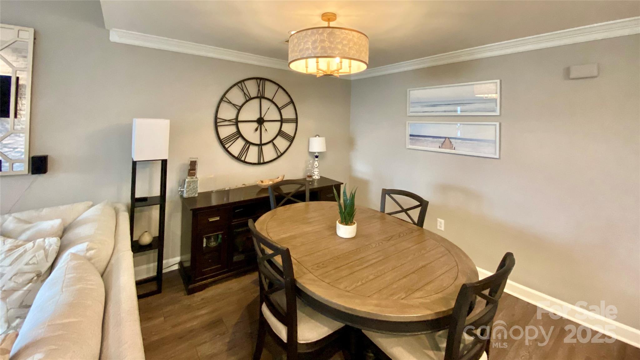 17810 Half Moon Lane, Unit L Cornelius, NC 28031 - Photo 11 of 48 a dining room with furniture and wooden floor