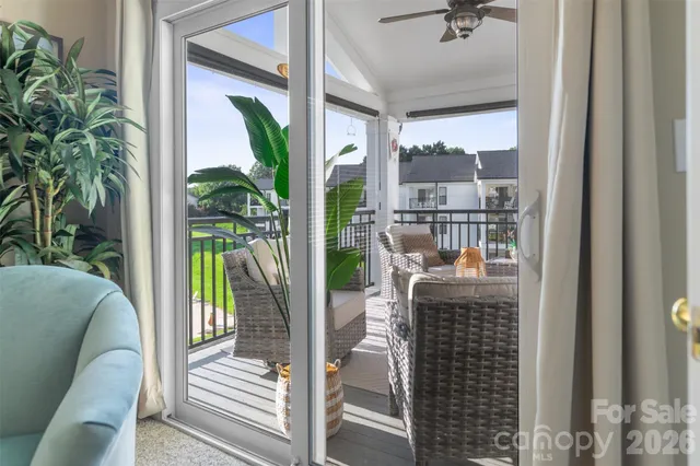 a view of swimming pool with outdoor seating and plants