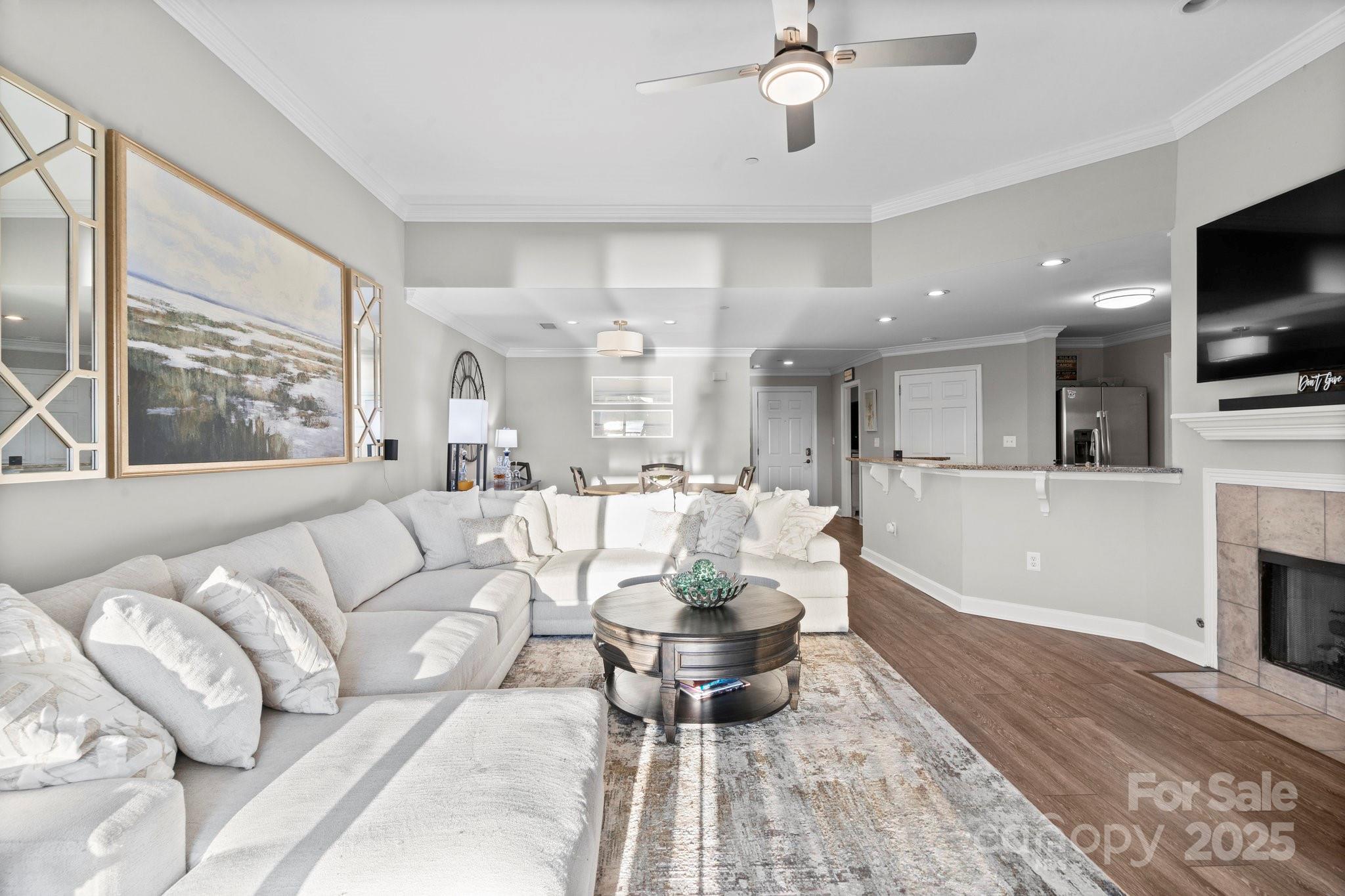 17810 Half Moon Lane, Unit L Cornelius, NC 28031 - Photo 15 of 48 a living room with furniture and a flat screen tv