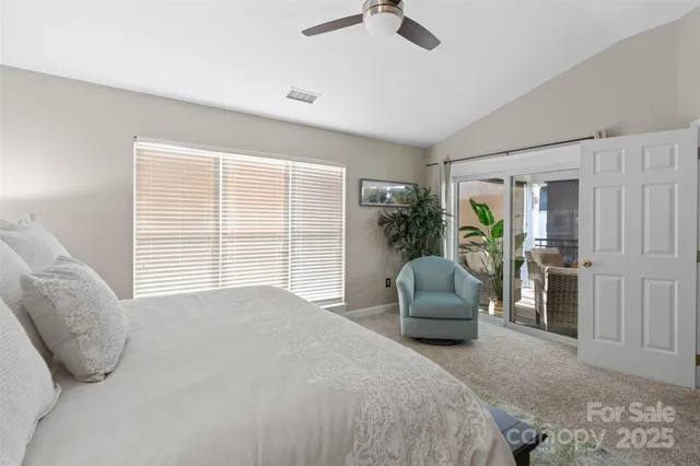 a bedroom with a bed and a couch