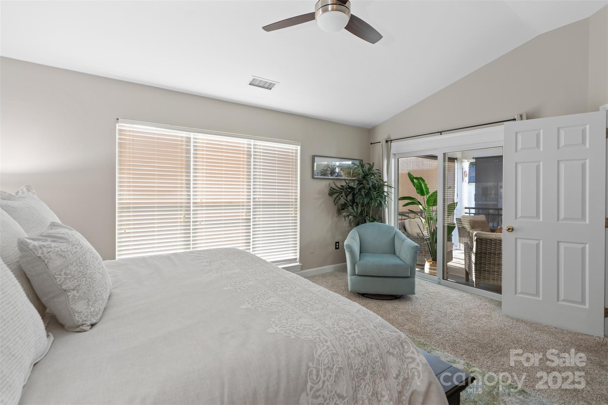 17810 Half Moon Lane, Unit L Cornelius, NC 28031 - Photo 22 of 48 a bedroom with a bed and a couch