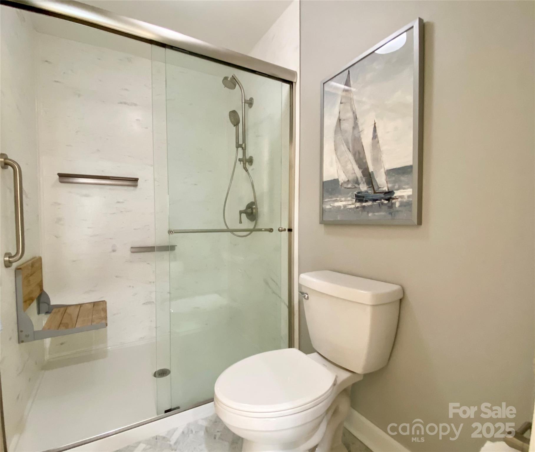 17810 Half Moon Lane, Unit L Cornelius, NC 28031 - Photo 26 of 48 a white toilet sitting next to a bathroom