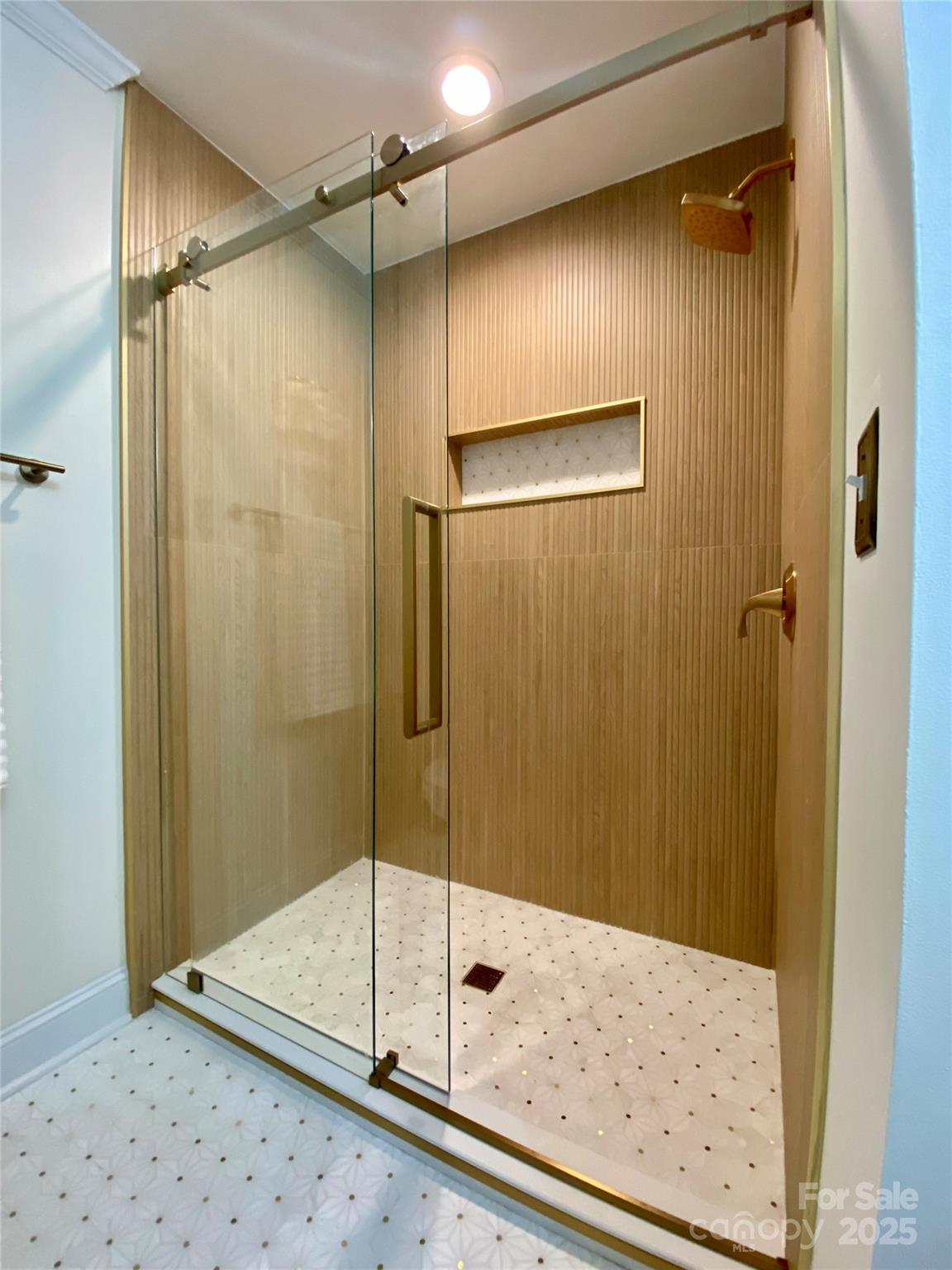 17810 Half Moon Lane, Unit L Cornelius, NC 28031 - Photo 30 of 48 a bathroom with a glass shower door