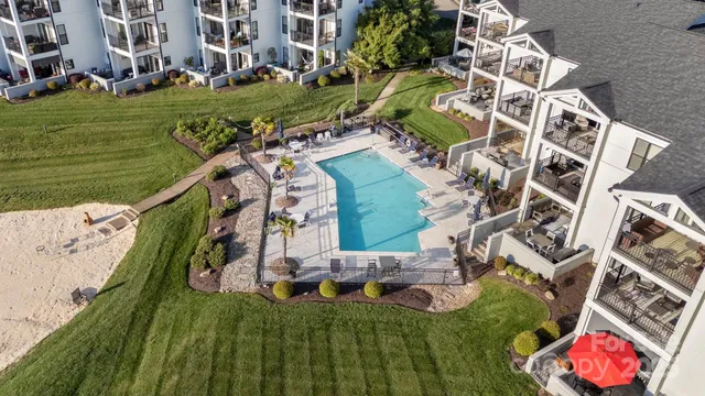 an aerial view of a house with outdoor space tennis court