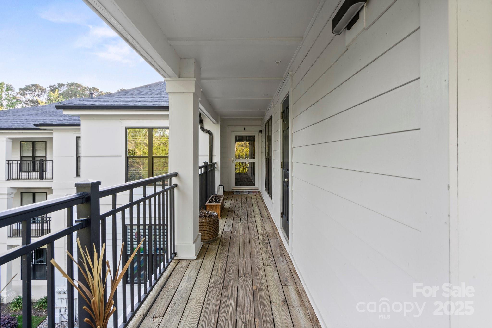 17810 Half Moon Lane, Unit L Cornelius, NC 28031 - Photo 7 of 48 a view of a house with wooden floor