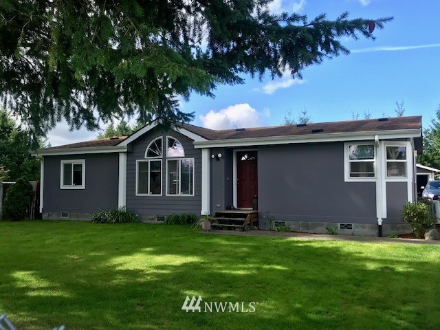18937 Guava Street Southwest Rochester, WA 98579 - Photo 1 of 25 a front view of house with yard and green space