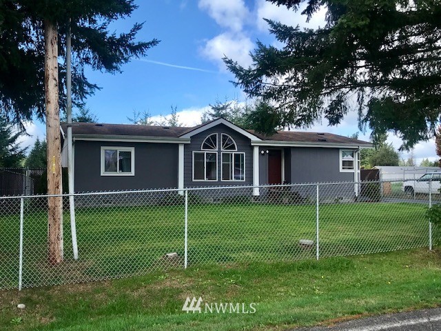 18937 Guava Street Southwest Rochester, WA 98579 - Photo 3 of 25 a view of a house with a backyard
