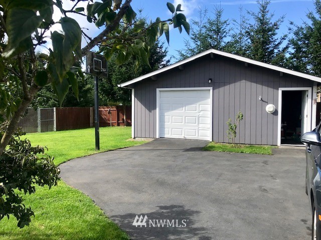 18937 Guava Street Southwest Rochester, WA 98579 - Photo 22 of 25 a house with trees in the background