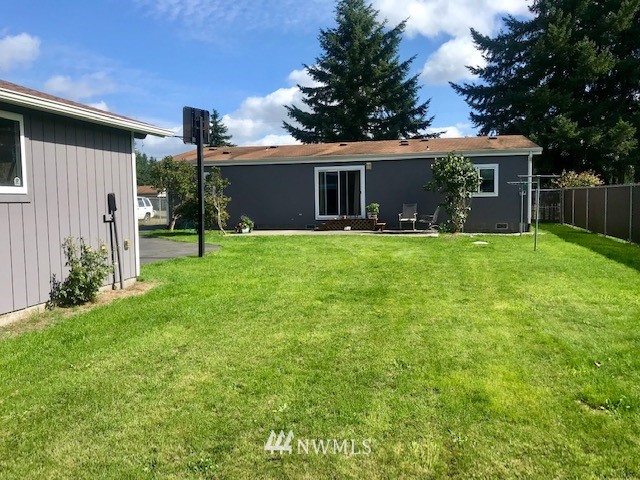 18937 Guava Street Southwest Rochester, WA 98579 - Photo 24 of 25 a front view of house with yard and green space