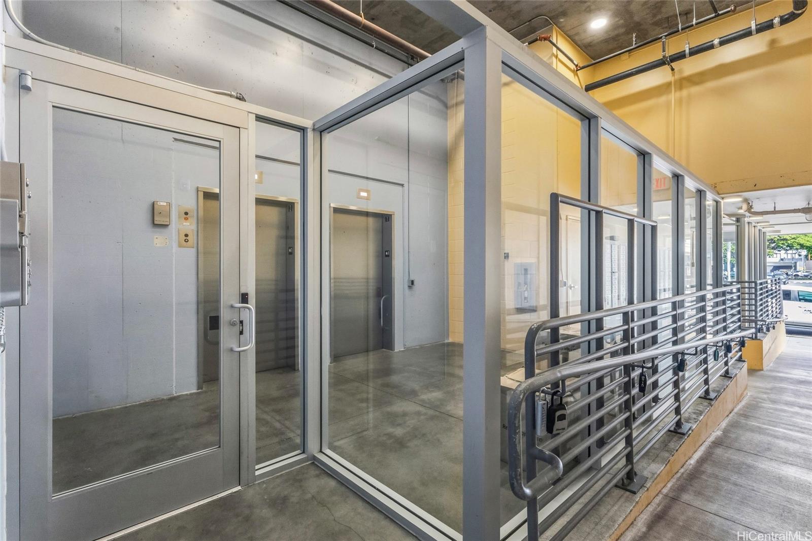 803 Waimanu Street, Unit 702 Honolulu, HI 96813 - Photo 11 of 19 a bathroom with sliding glass door shower and sink